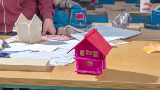 Students Having Art Class Constructing Small Wooden Houses Also Colouring — Stock Video