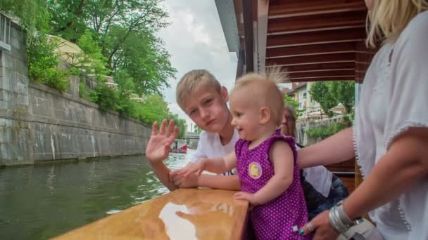 Children Standing Wooden Boat Sailing River Ljubljanica Observing Water — Stock Video
