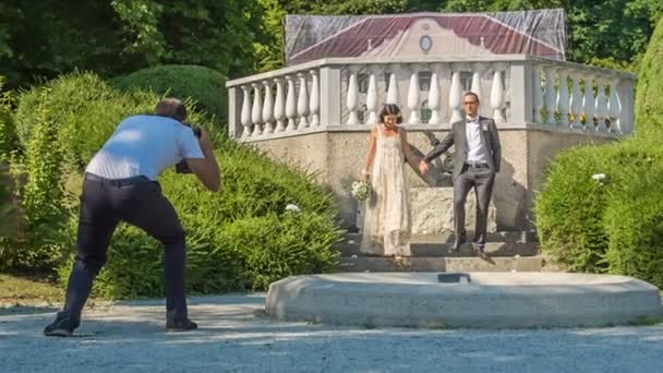 Photographer Taking Photos Newlyweds Walking Stairs Park Hand Hand — Stock Video