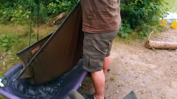 Young Fisherman Putting Fish Another Basket — Stock Video