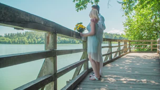 Love Couple Observing Lake Woman Holding Bouquet Yellow Flowers Gorgeous — Stock Video