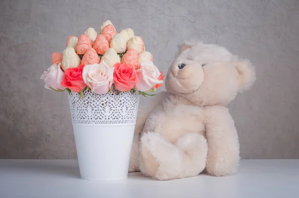 Fruit bouquet decoration with teddy bear toy on the table