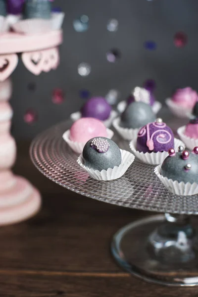 Variety of fruits covered with a color chocolate — Stok Foto