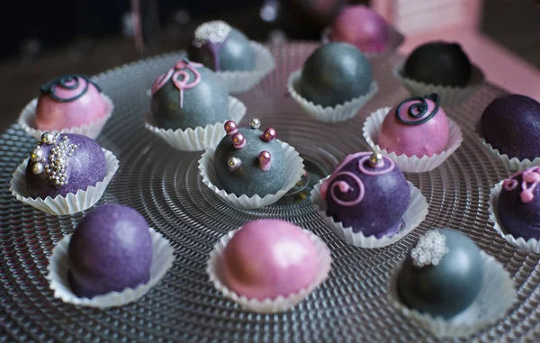 Variety of fruits covered with a color chocolate — Stok Foto