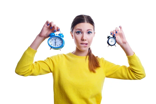 Young beautiful woman holding big and small clocks — Stock Photo, Image