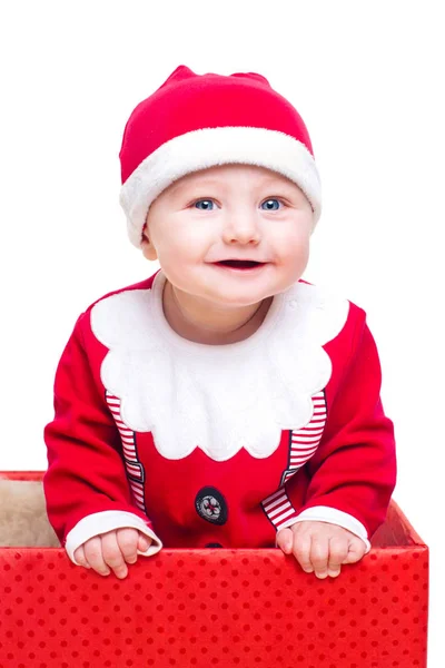 Baby pojke står i en stor julklapp låda — Stockfoto