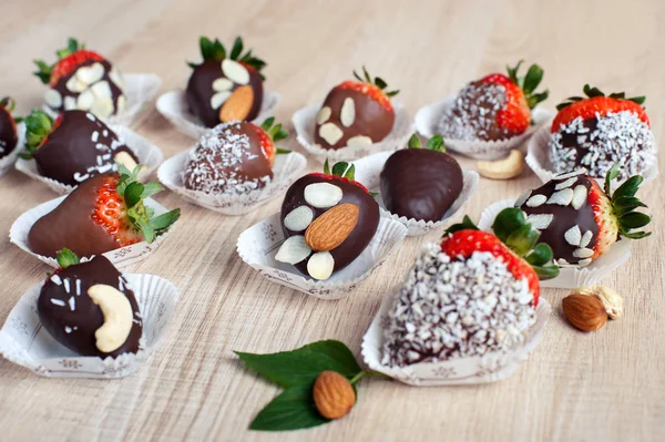 Strawberry covered with milk and dark chocolate and coconut flak — Stockfoto