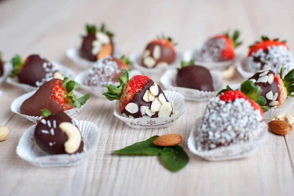 Variety of strawberries covered with milk and dark chocolate — Photo