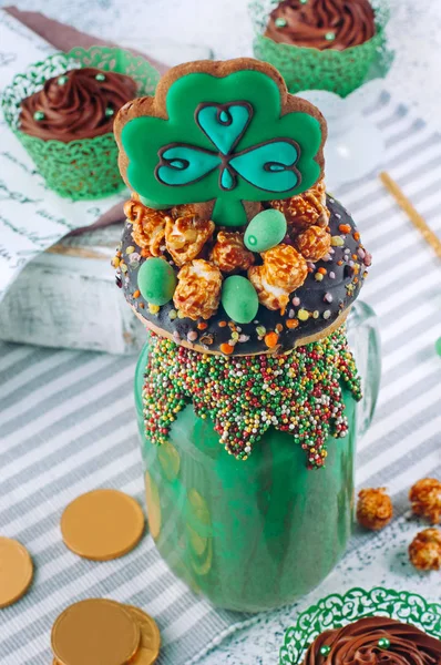St. Patrick\'s Day freak shake topping with clover cookie and cho