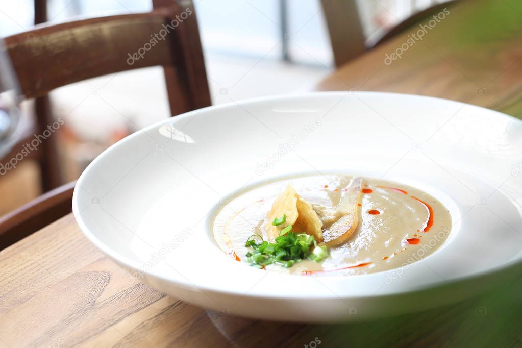 Creamy leek soup with pear and parmesan cheese.