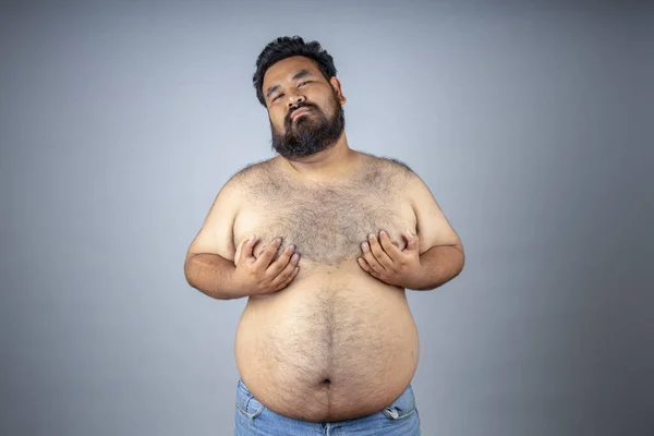 Fat men on a white background. Fat man with a big belly. Fat man eat a lot of food, extra weight, diet.