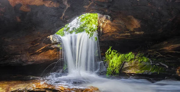 Panoramic photo landscape, Waterfall hidden in the tropical, The beautiful waterfall in forest, The fascinating waterfall in the forest and water flows through a hole.