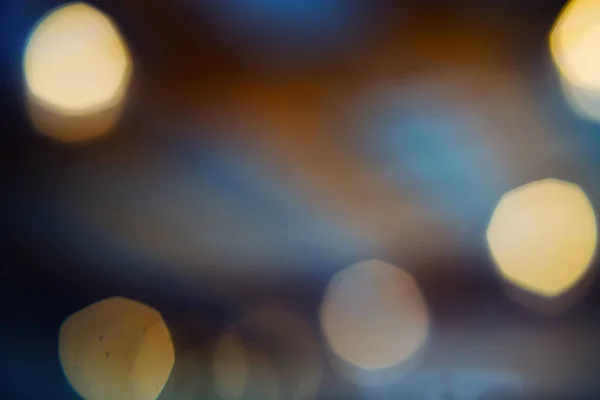 Bulanık bokeh altın ve mavi ışık soyut arka plan.