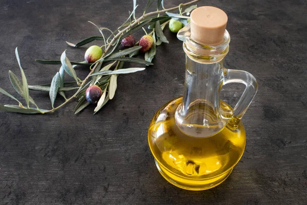 Many types of olive like green & black and olive oil at the rustic wooden table , olive concept with olive oil in the bottle