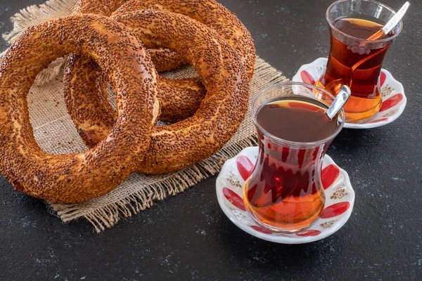 Traditional Turkish breakfast with Turkish bagel simit on the table. Food concept on the table at the restaurant.