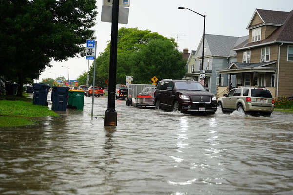 Citizens of Fond du Lac drive through the flooded streets in their vehicles from the huge downpour of rain during the afternoon in july 2020.  
