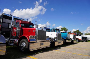 Waupun, Wisconsin USA - August 11th, 2023: Many different colorful semi trucks showed up at Waupun's annual Truck-n-Show. clipart