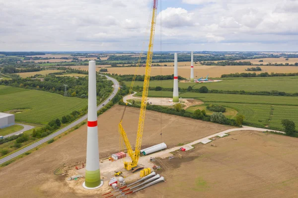new wind turbines will be erected on a field
