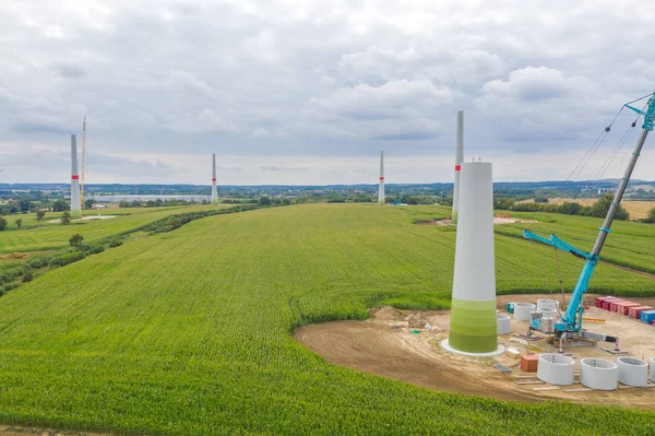 new wind turbines will be erected on a field