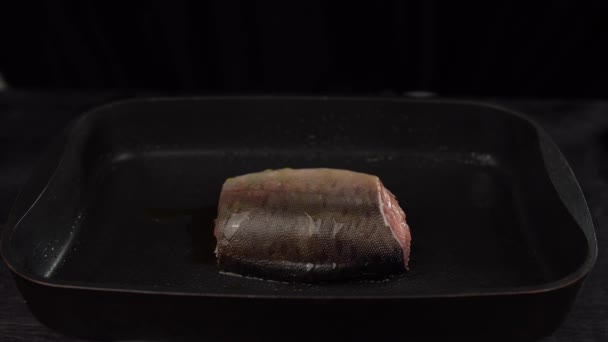 Slice of red fish fried in deep pan. — Stock Footage Slice of red fish fried in deep pan. Royalty Free Stock Video