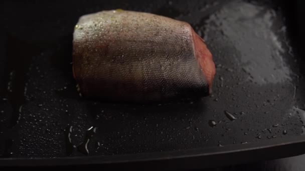 Slice of red fish fried in deep pan. — Stock Footage Slice of red fish fried in deep pan. Royalty Free Stock Video