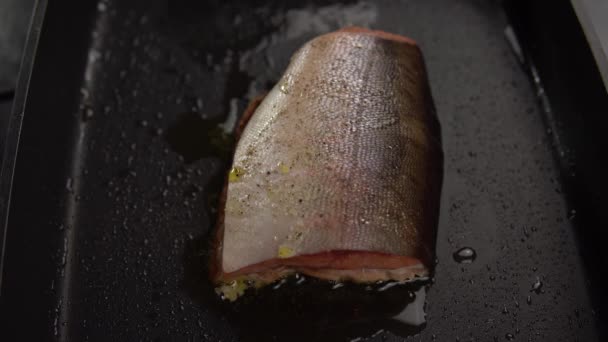 Slice of red fish fried in deep pan. — Stock Footage Slice of red fish fried in deep pan. Video Clip