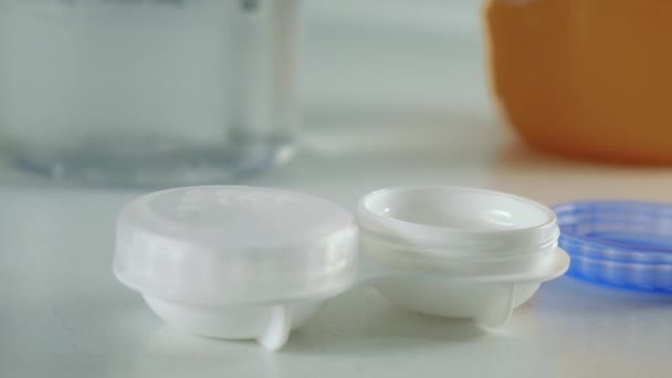 Contact lens care: taking contacts from the lens case — Stock Video