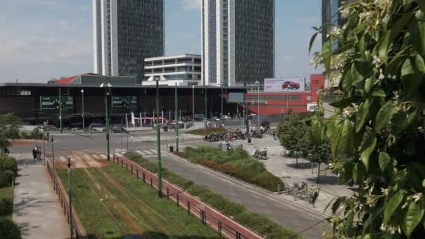 Milan, Italy - May 2016: Traffic at Garibaldi Station, tilt shot on skyscrapers — Stock Video