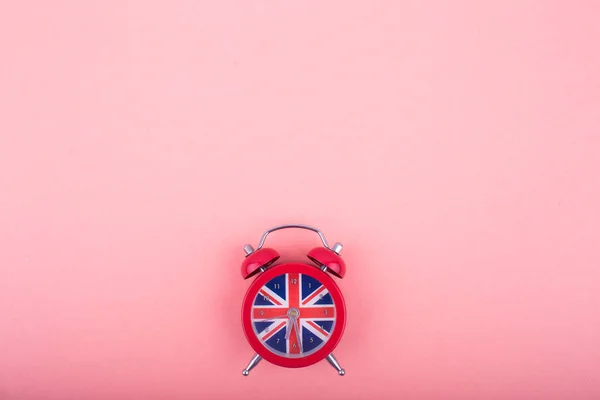 English clock with the colors of the British flag. Time to learn English.