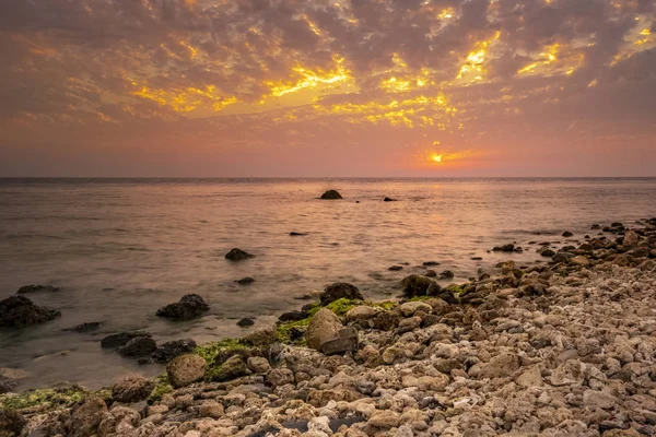 Scenic view of sunset sky over calm tropical ocean