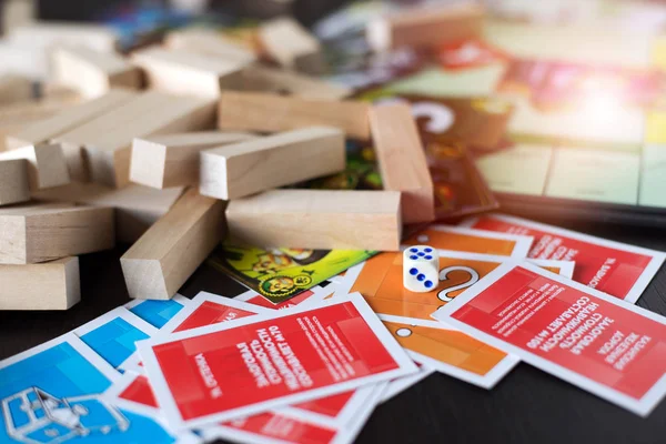 Colorful play figures and cards with dice on board — Stock Photo, Image