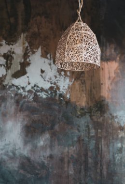 Lamps that are combined with natural ingredients and express the local culture of Thailand against the backdrop of a grand-faced textured loft-style wall. clipart