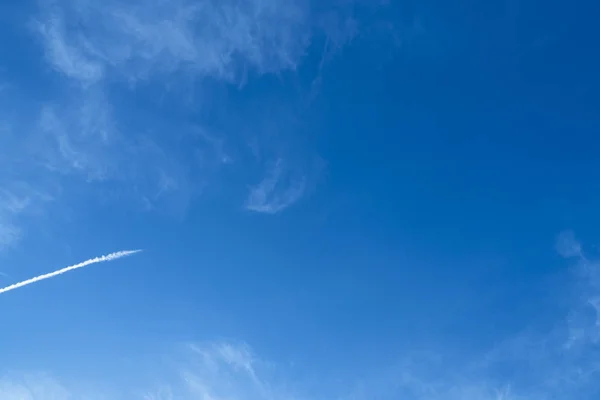 Blue sky background with clouds. Image of clear blue sky and white clouds on day time for background usage.