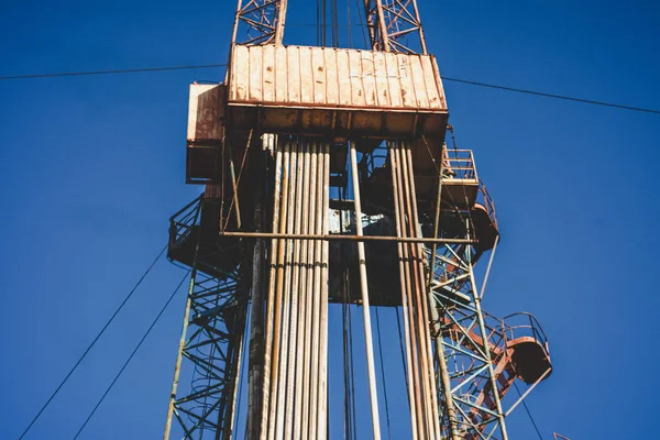 Oil drilling rig operation on the oil platform in oil and gas industry. Industrial concept. Toned.