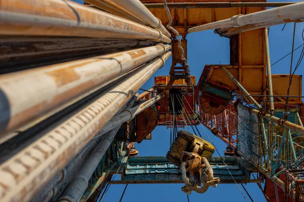 Oil drilling rig operation on the oil platform in oil and gas industry. Industrial concept. Toned.