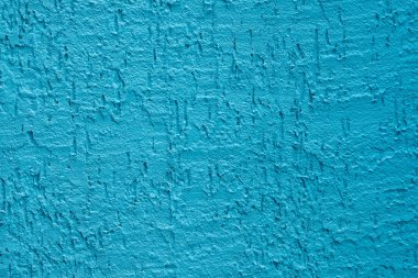 Mavi beton duvar, pürüzlü yüzey mavi kum gibi görünüyor. Arka plan desen tasarımı. Eski açık mavi çimento dokusu ve arkaplanı.