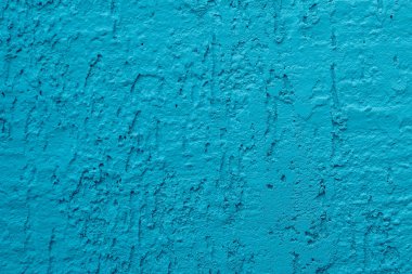 Mavi beton duvar, pürüzlü yüzey mavi kum gibi görünüyor. Arka plan desen tasarımı. Eski açık mavi çimento dokusu ve arkaplanı.