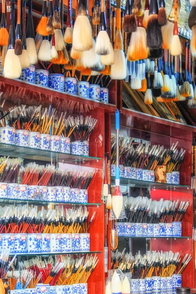 Calligraphy chinese brushes pens with decorations on sales at the market different style different size