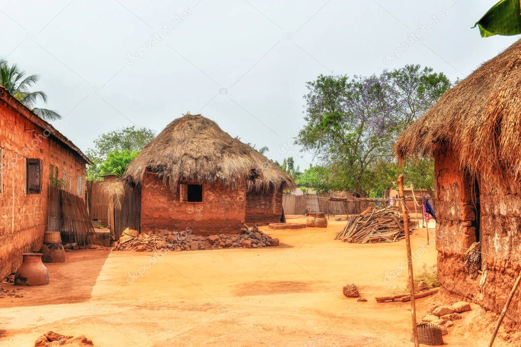 Traditional clay houses with thatched roof. African village. Rural area, Ghana