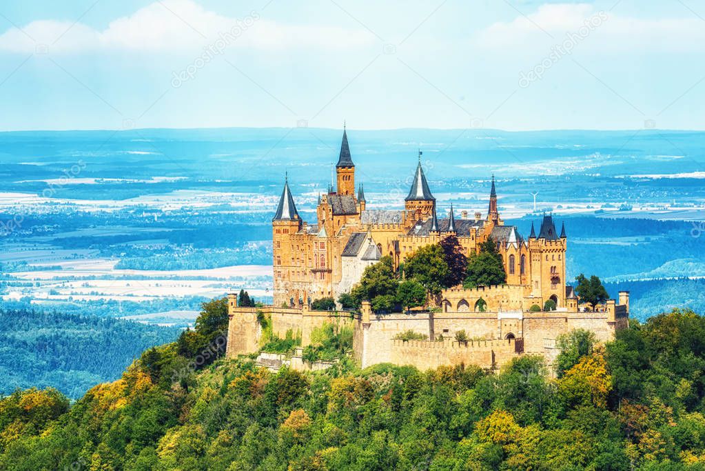 Hechingen, Germany - August  17, 2018: Aerial view of famous Hohenzollern Castle, ancestral seat of the imperial House of Hohenzollern and one of Europe's most visited castles, in beautiful golden evening light, Baden-Wurttemberg, Germany