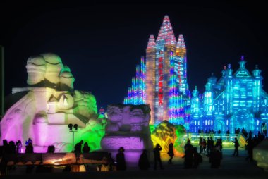 Famous Ice & Snow World Festival park with illuminated ice sculptures and structures. clipart