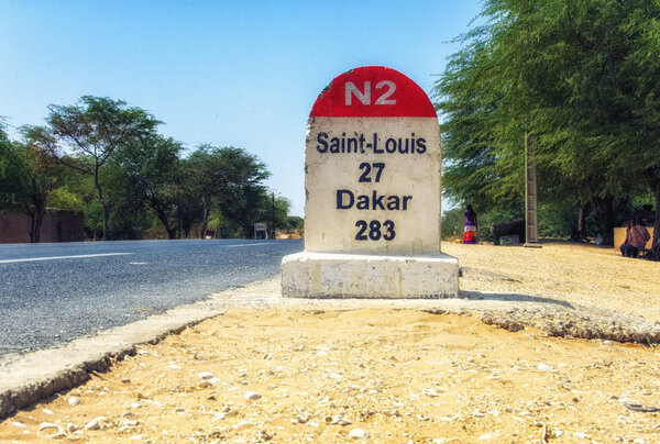Dakar road sign against clear blue sky
