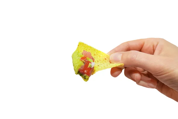 Nachos with guacamole. Nachos chips in the hand. Isolated on white. — Stock Photo, Image