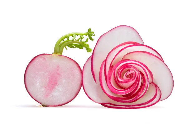 Rose from cut radish slices and half a radish with green shoots on a neutral white background