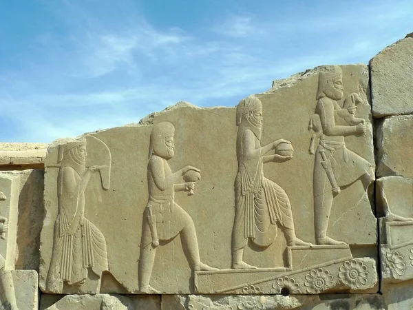 Bas-relief of people from multi-nations offer tributes to persian king.Persepolis,Iran