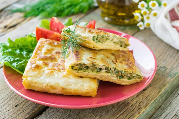 Fried pita bread stuffed with chicken, cheese and herbs served o — Stock Photo, Image