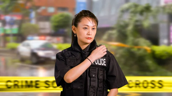 Asian American Woman Police Officer at Crime scene Calling for Backup on CB Radio
