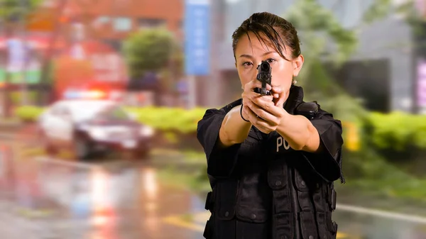 Asian American Woman Police Officer at Crime scene Pointing Pistol