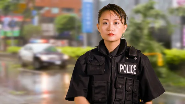 Asian American Woman Police Officer at Crime scene looking Serious