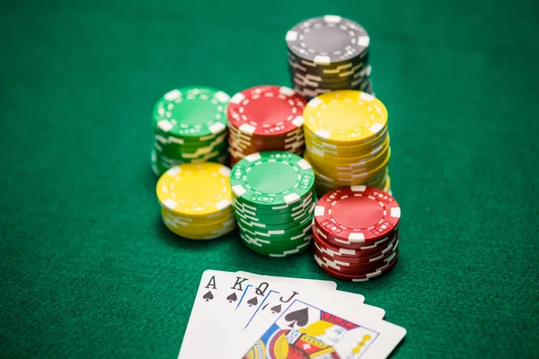 Casino Chips Ace King Queen Jack Spades Green Table — Stock Photo, Image